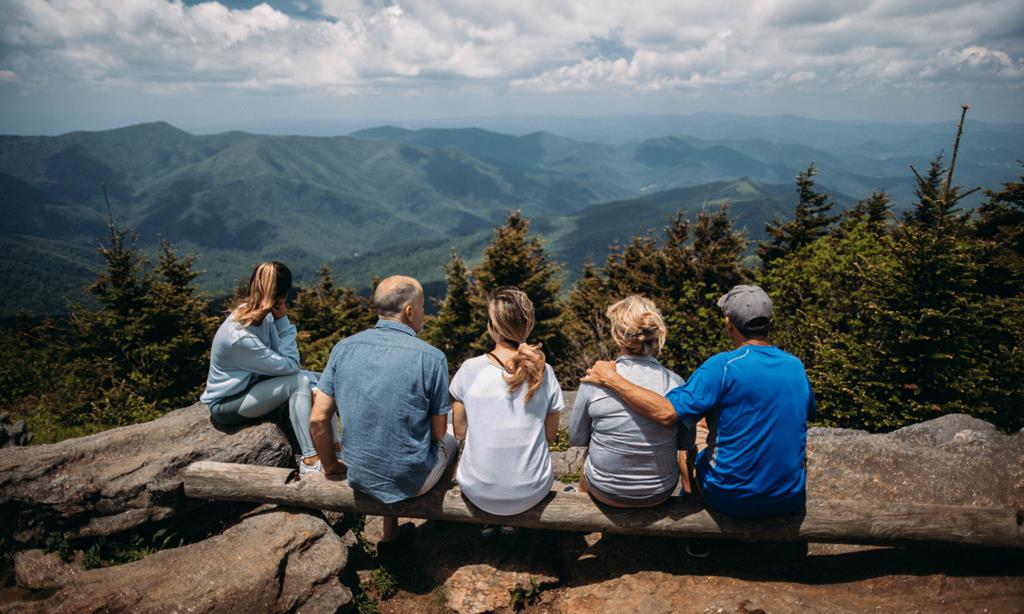 Multi-generational family resting after a hike in nature_Individuals_Family_Business_Owner_Financial Planning_Advisor IO https://seva-wealth.com/wp-content/uploads/2026/01/Multi-generational-family-resting-after-a-hike-in-nature_Individuals_Family_Business_Owner_Financial-Planning_Advisor-IO.jpg
